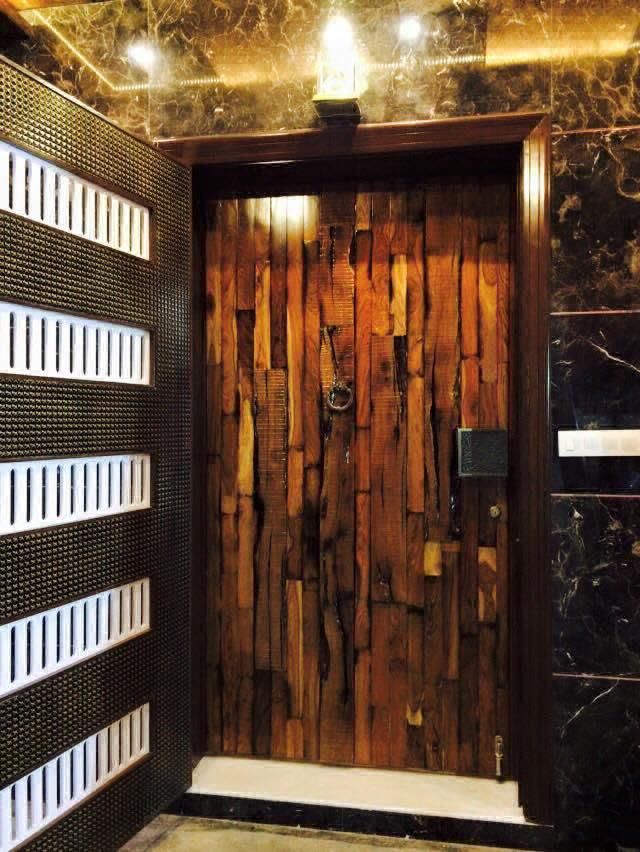 Entrance Wooden Main Door with Glossy Finish & Ornamented with Traditional Looking Fixtures