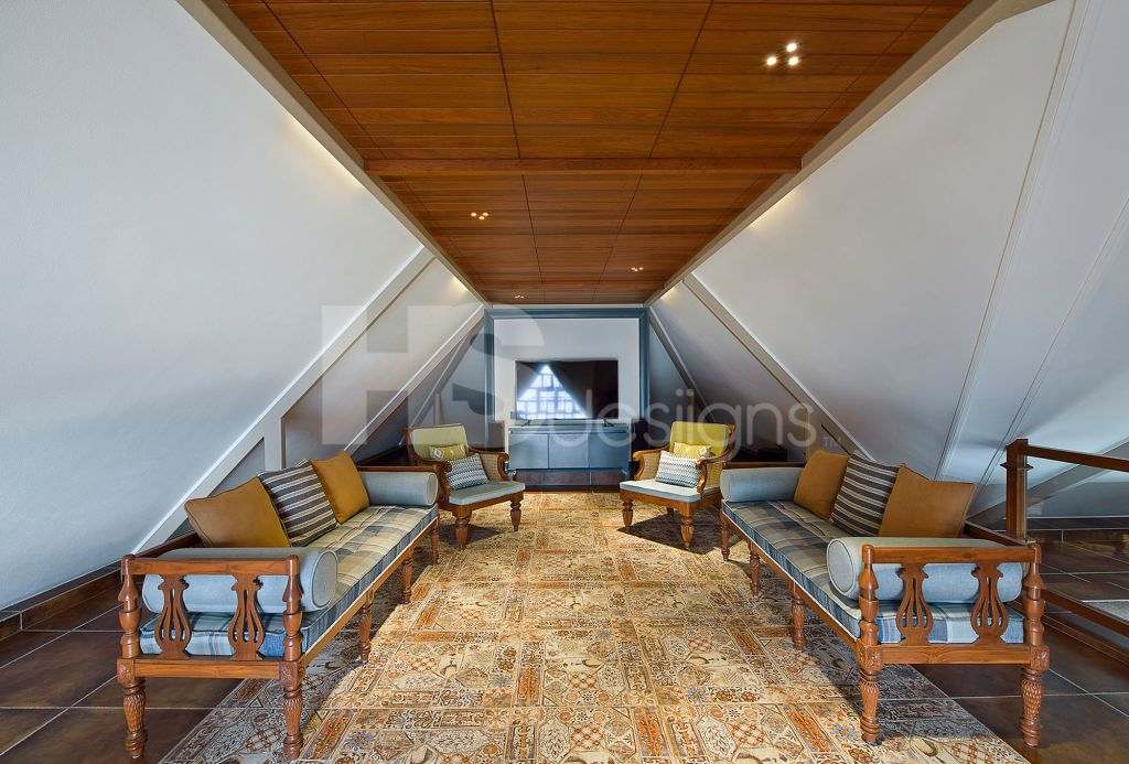 Extraordinary shaped Living Room with Slant Walls & Roofs, accommodating Traditional Styled Wooden Sofa Set