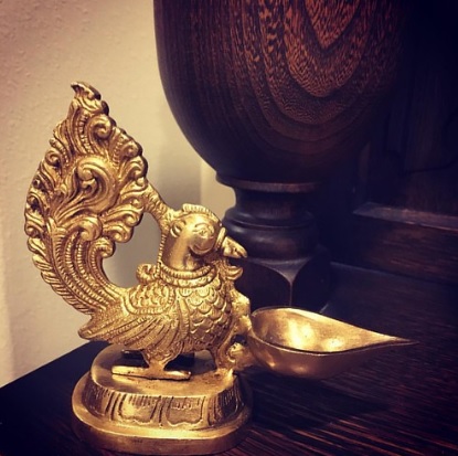 Brass diya with tree design Brass diya with tree design