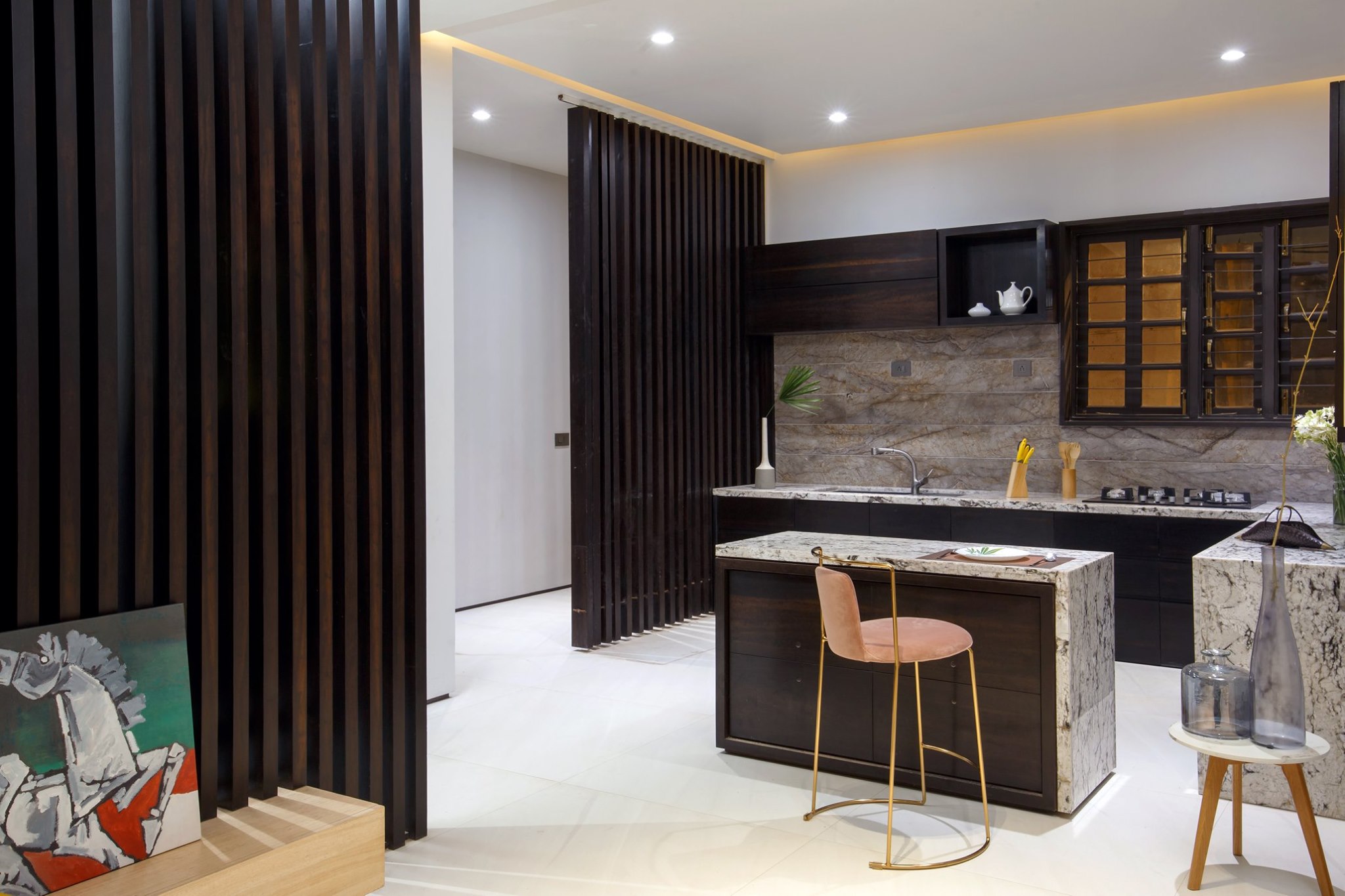 A modern kitchen in shades of brown with a mix of modern design