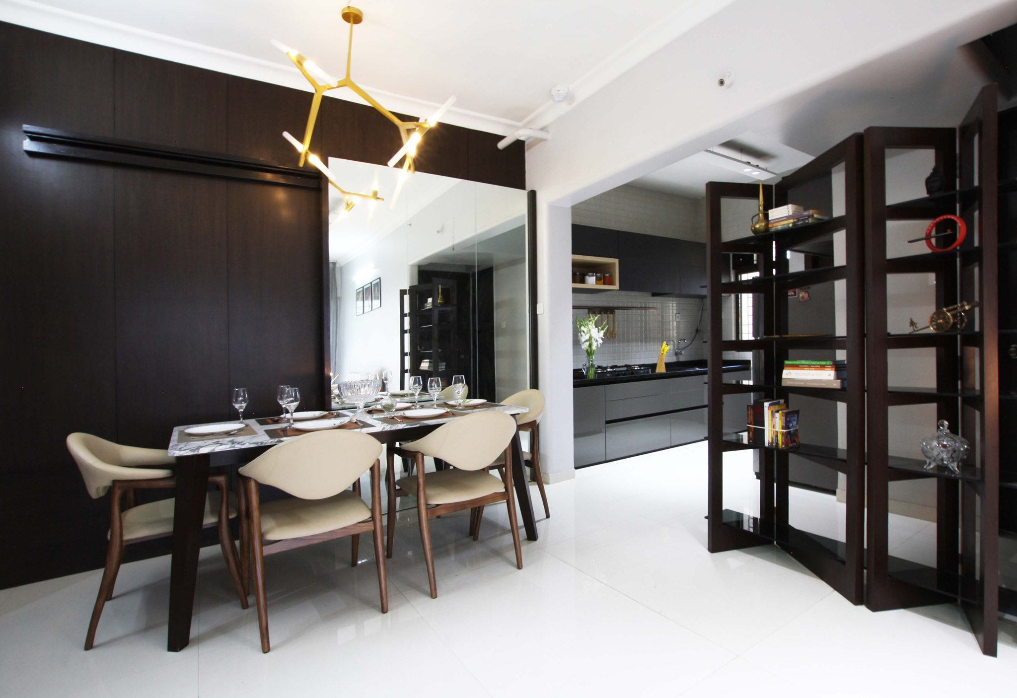 Dining area with sparkling white floor and dark wooden panel