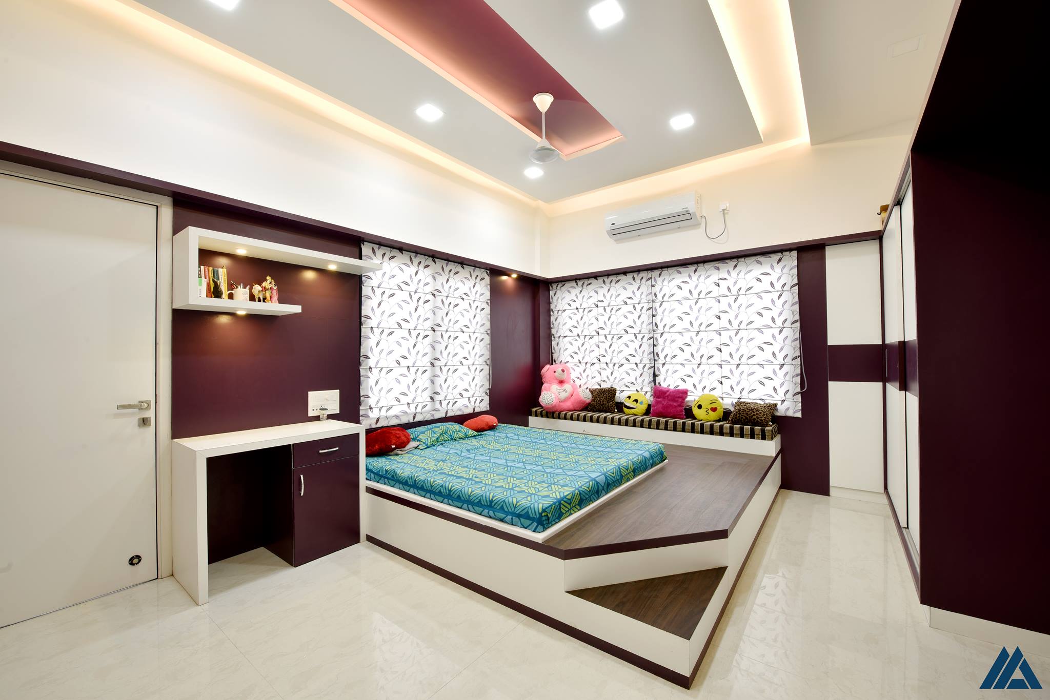 A modern designed kid's bedroom in a maroon and white combination