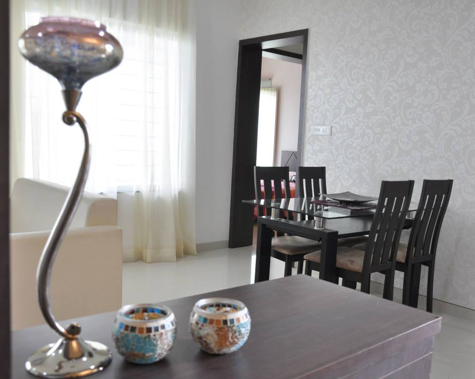 Classic wooden dining table and chair painted in dark brown