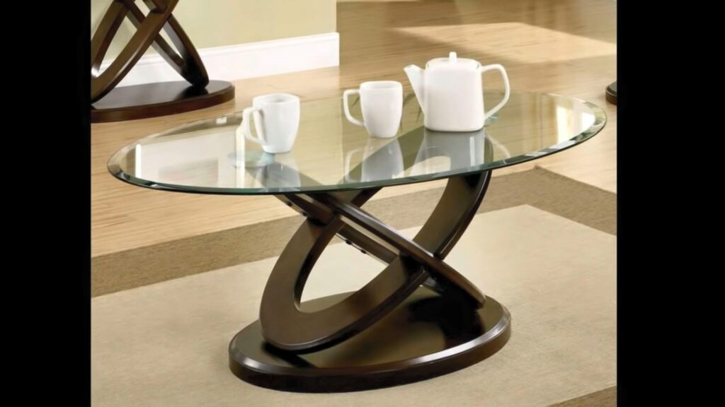 A galactic shaped brown painted wooden table with glass top
