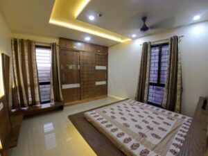 A minimalistic bedroom with wood all over the room