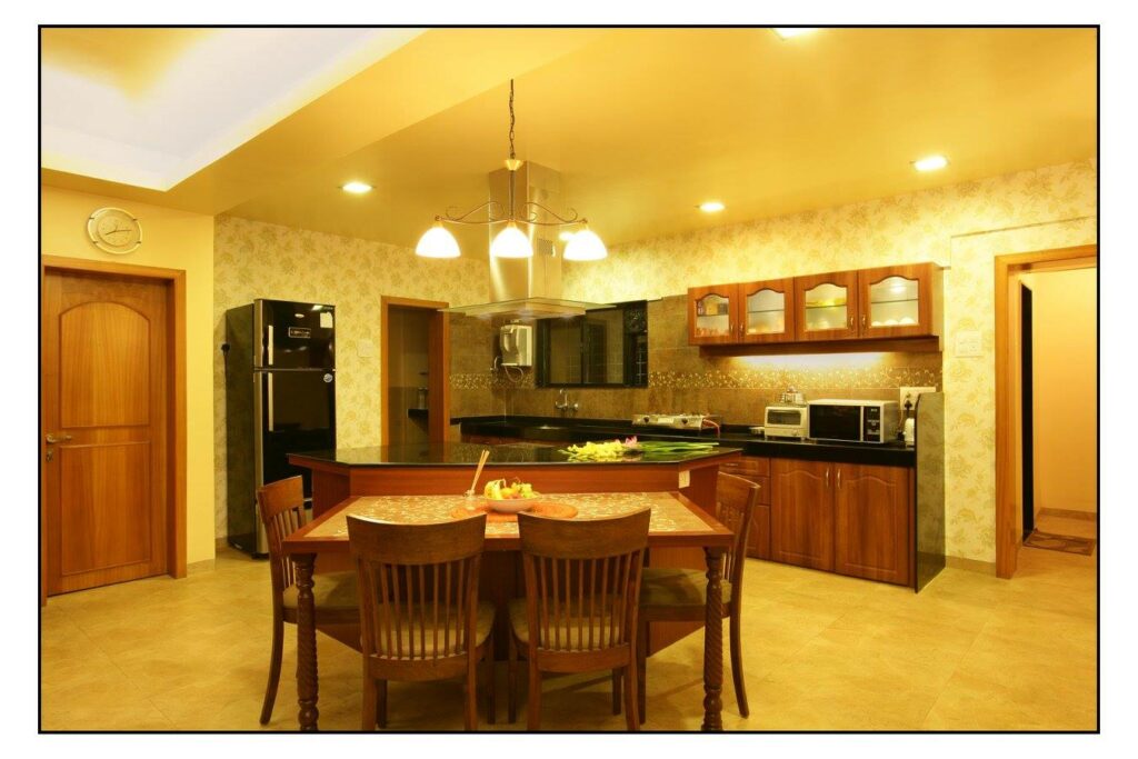 A kitchen area with combined dining