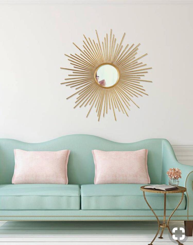 2 Seater Camelback Sofa having Pale Green Rexine Upholstered with Wooden Legs is Placed with Circular Metal Table