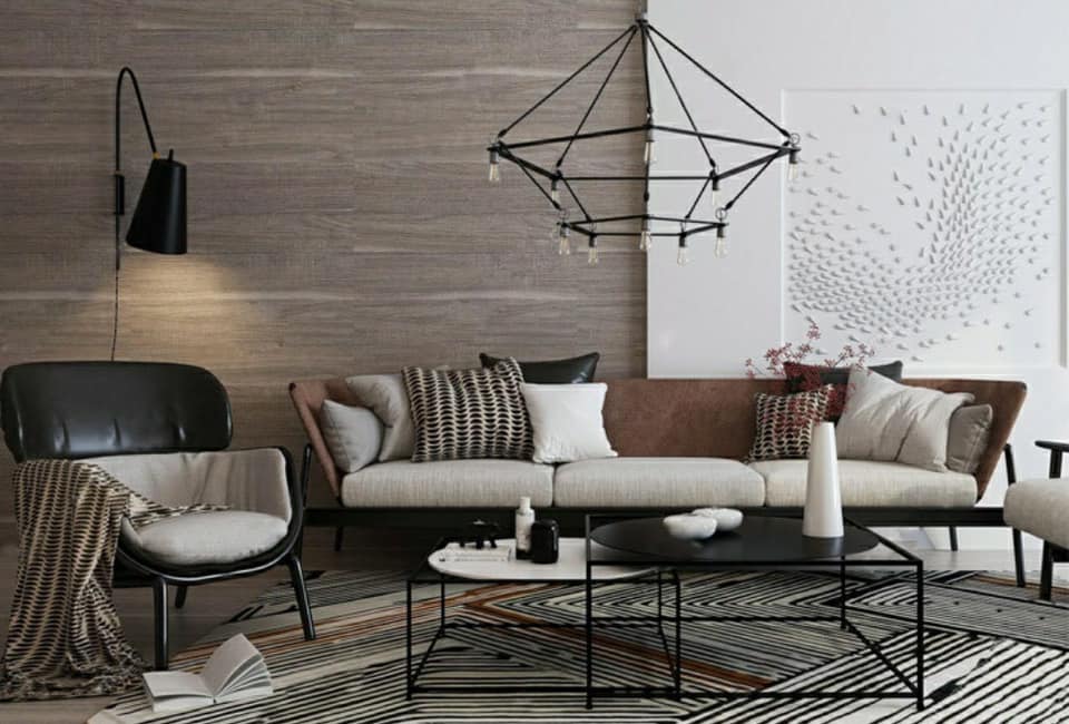 3 Seater Upholstered Sofa having an Inclined Armrest is Placed with Black & Grey Upholstered Chairs in this Living Room