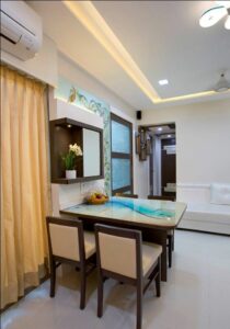 A Compact House has 4 Seater Dining Table with Acrylic Table Top & Wooden Framed Upholstered Chairs - 2