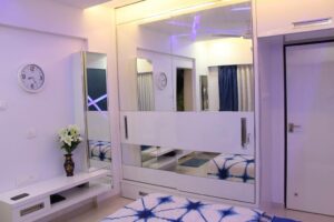 The Bedroom has White & Blue Main Colours in Design - 1
