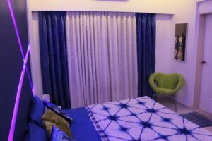 The Bedroom has White & Blue Main Colours in Design