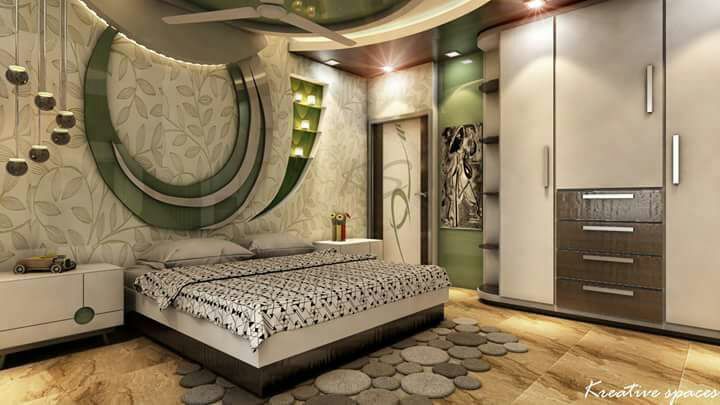 The Bedroom having a Black & White Rectangular Bed with Side Table on Both sides