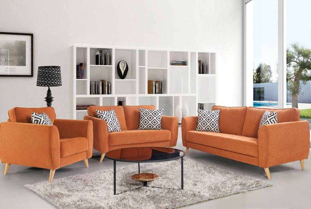 The 2 Seater & 1 Single Seater Orange Upholstered Sofa having Wooden Legs are Nicely Place in the Living Room