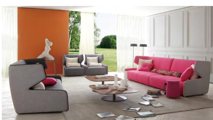 The 3-Seater & Single Seater Grey & Pink Sofa with White & Orange Walls are Making this Space Vibrant