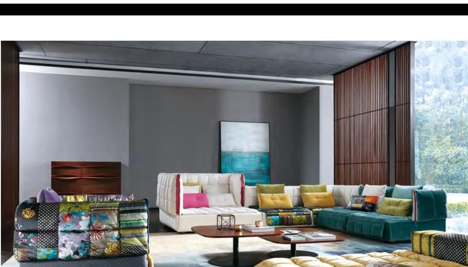 The Colouful Upholstered Tufted Sofa is Adding Vibrant touch to this Living Room