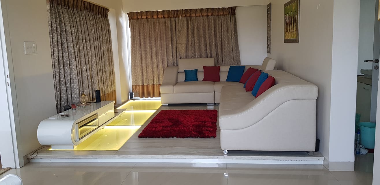 The L - Shape White Leather Upholstered Sofa with S.S. Legs & Curved Armrest Looking Stylish & comfortable