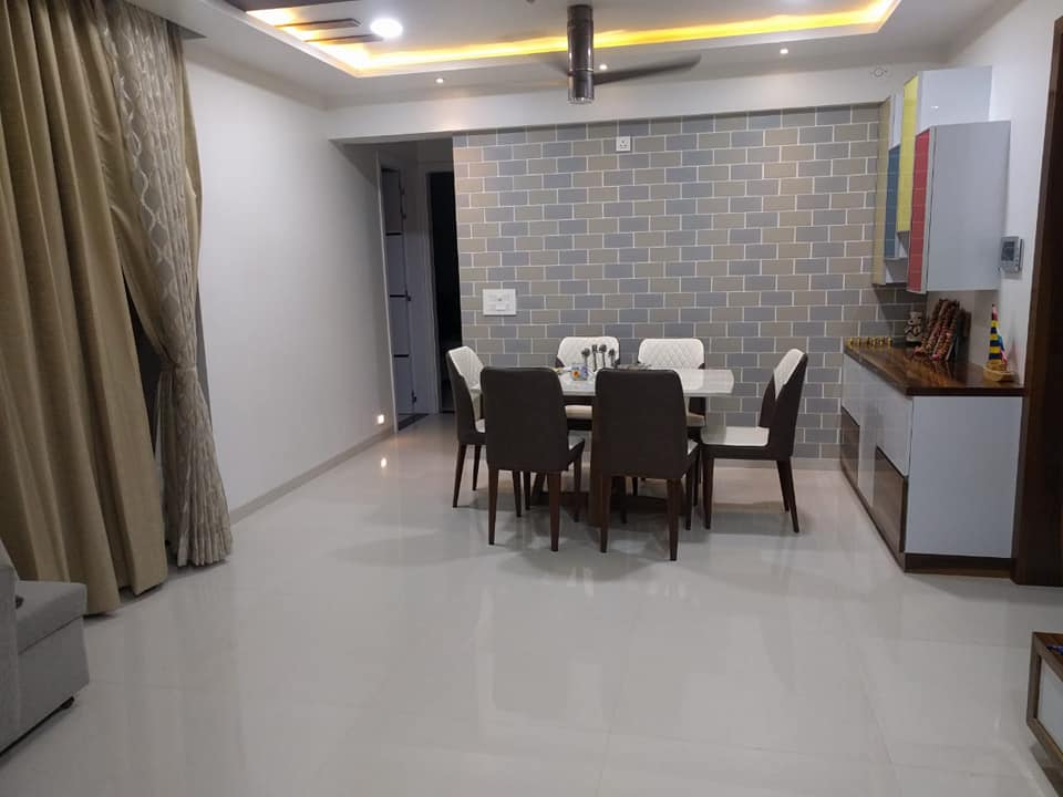 The White Dining Space Consists of 6 Seater Dining Table