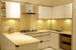 Handleless White Cabinetry with a Glossy Finish