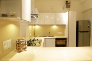 Handleless White Cabinetry with a Glossy Finish
