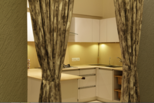 Handleless White Cabinetry with a Glossy Finish